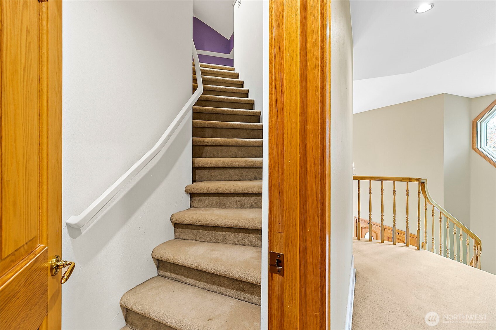 Hidden staircase to loft.