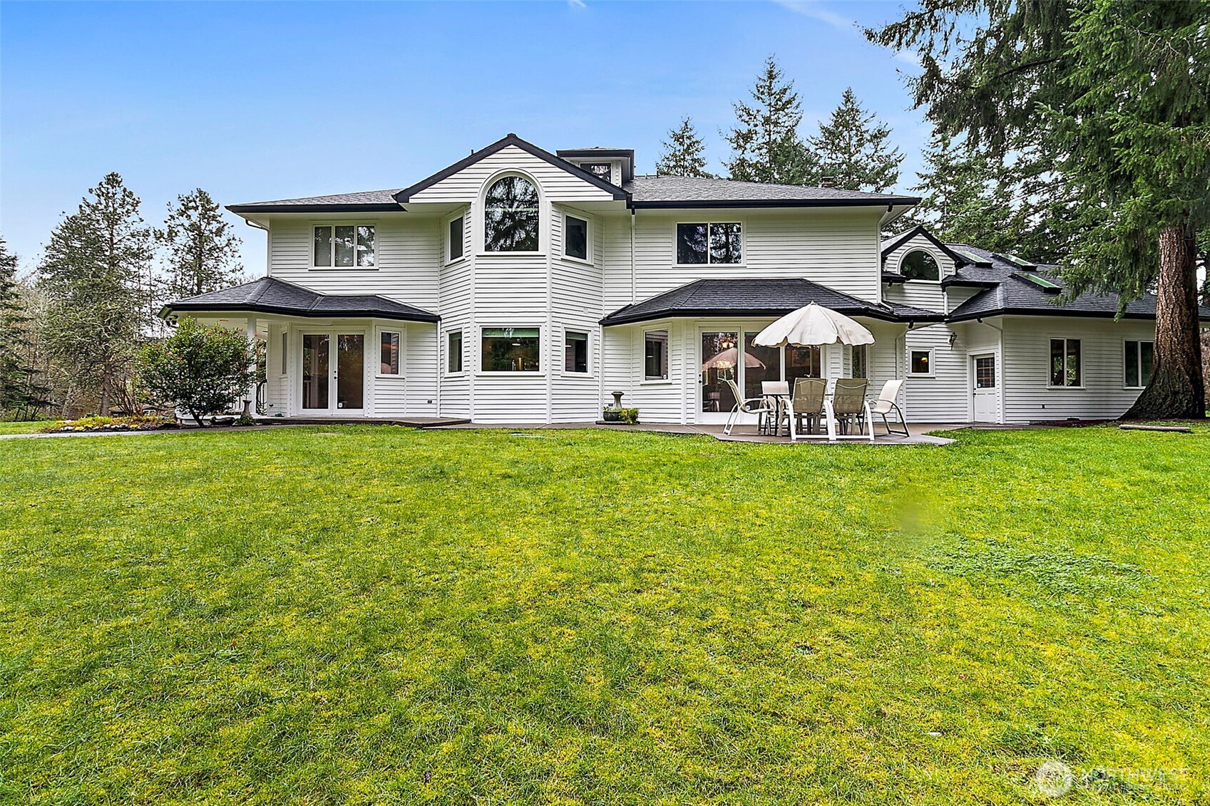 Backyard with green space.