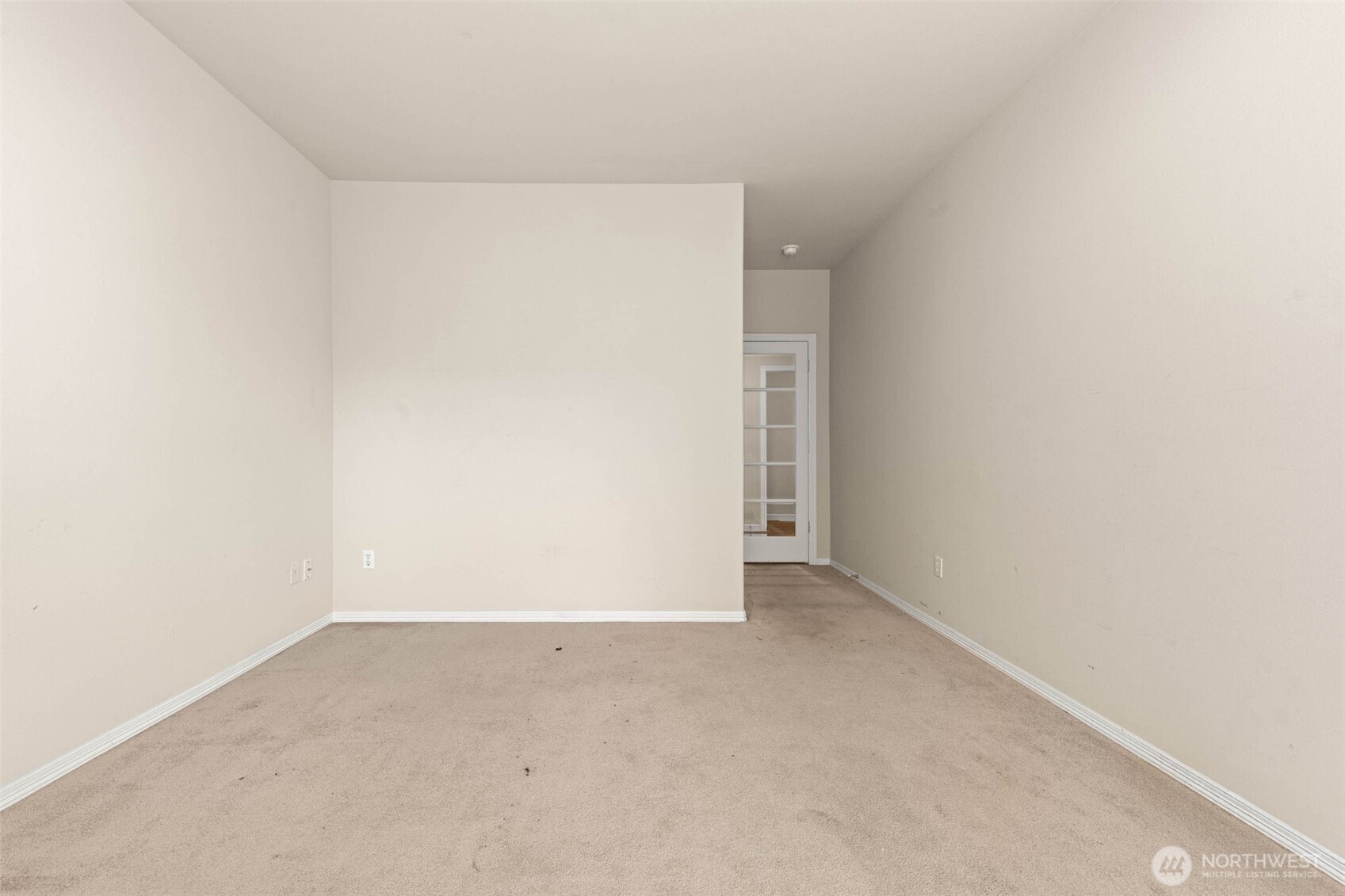 Downstairs bedroom with glass door