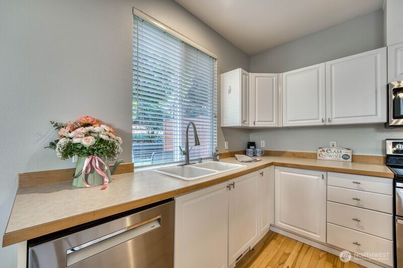 Another view of the kitchen with large window - great for passing through meals inside/outside.