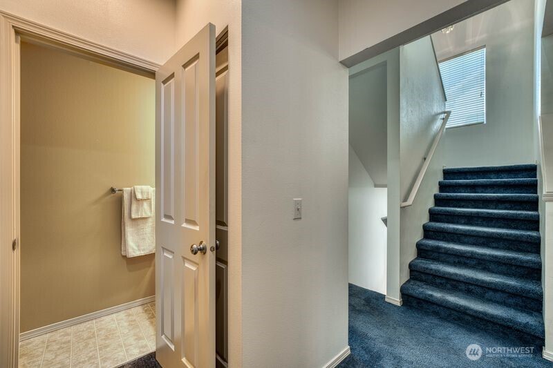 Upper level floor 2 half bath and stairs to the upper level floor 3.