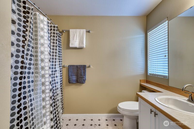 Primary ensuite with bath tub and shower.