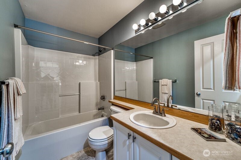 Upper level floor 3 full hall bath with tub and shower.