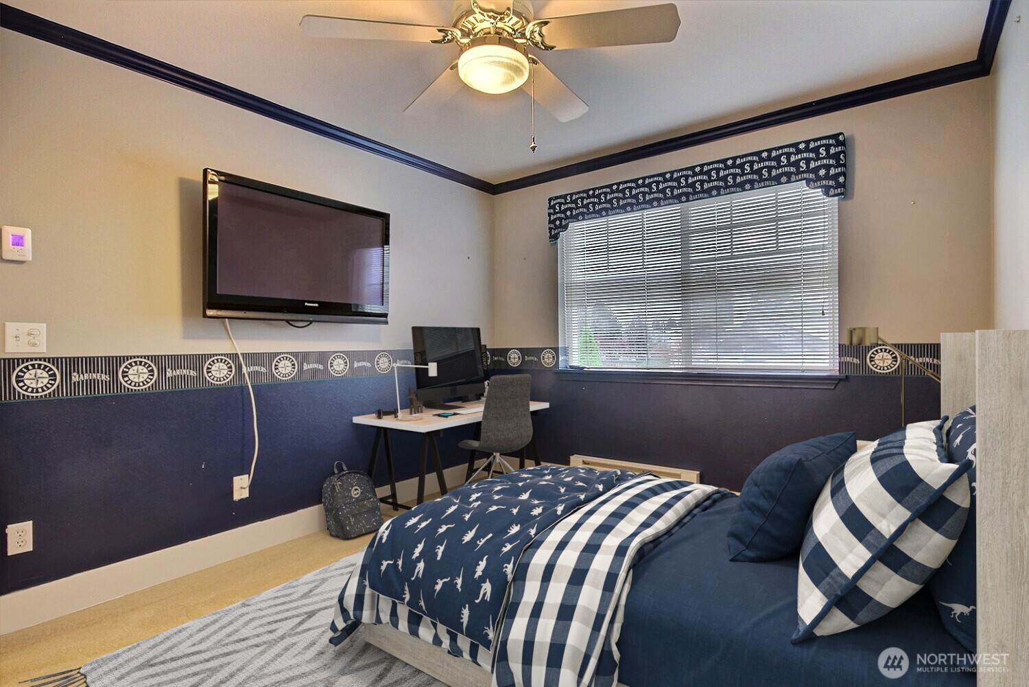 In this Seahawks-Inspired Bedroom Retreat, sports enthusiasts will appreciate the dedicated Seahawks-inspired bedroom, thoughtfully designed with team logos to showcase your passion for the game. This room is the perfect spot to relax and enjoy your favorite sports, as the TV remains in place, allowing you to catch every play and cheer on your team in comfort.