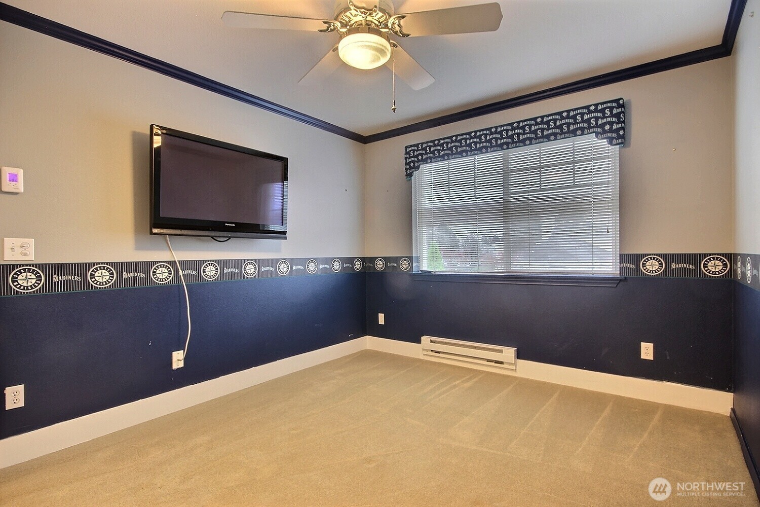 Seahawks bedroom with   closet space. TV Stays!