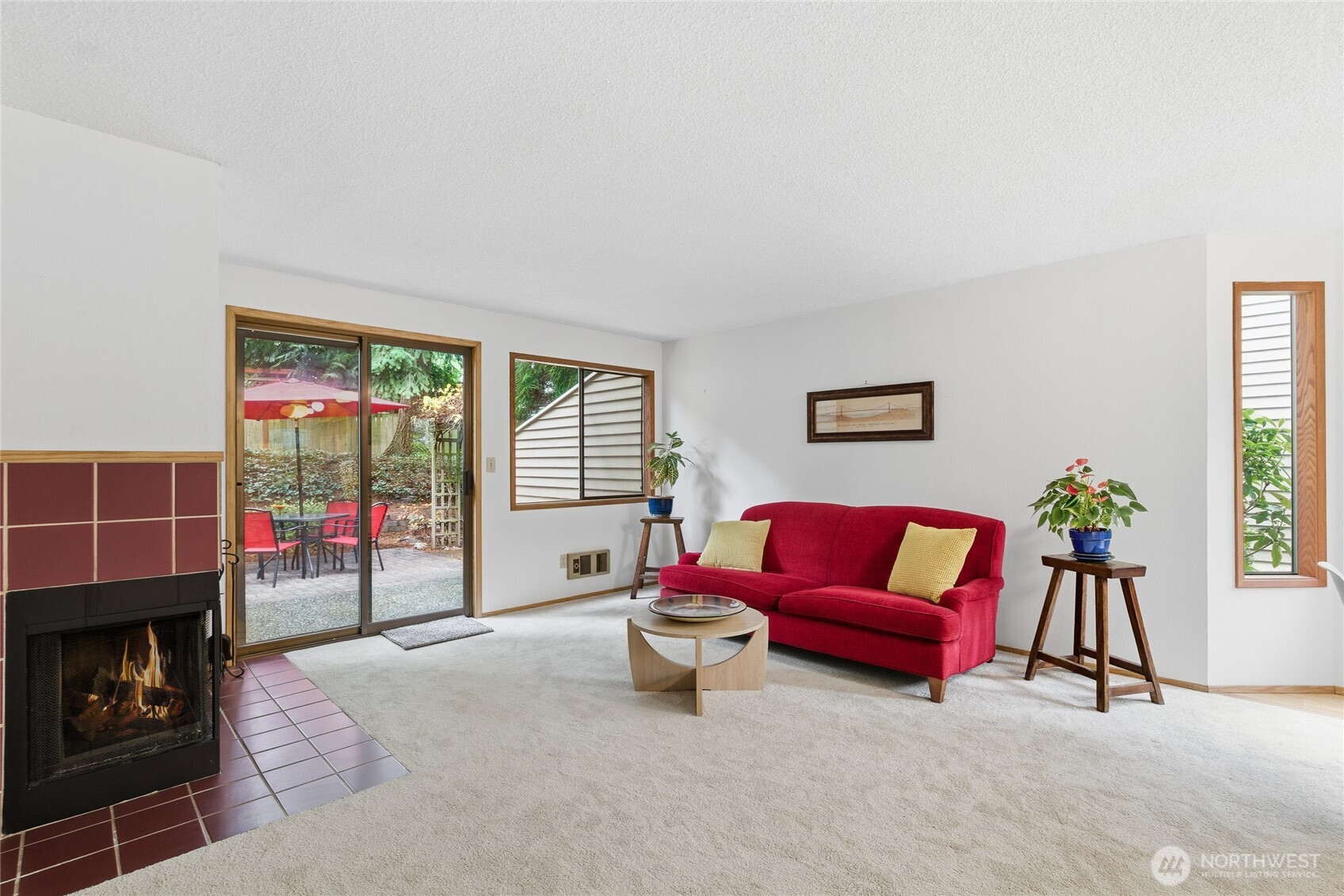 private secluded back yard brick patio with lush garden space