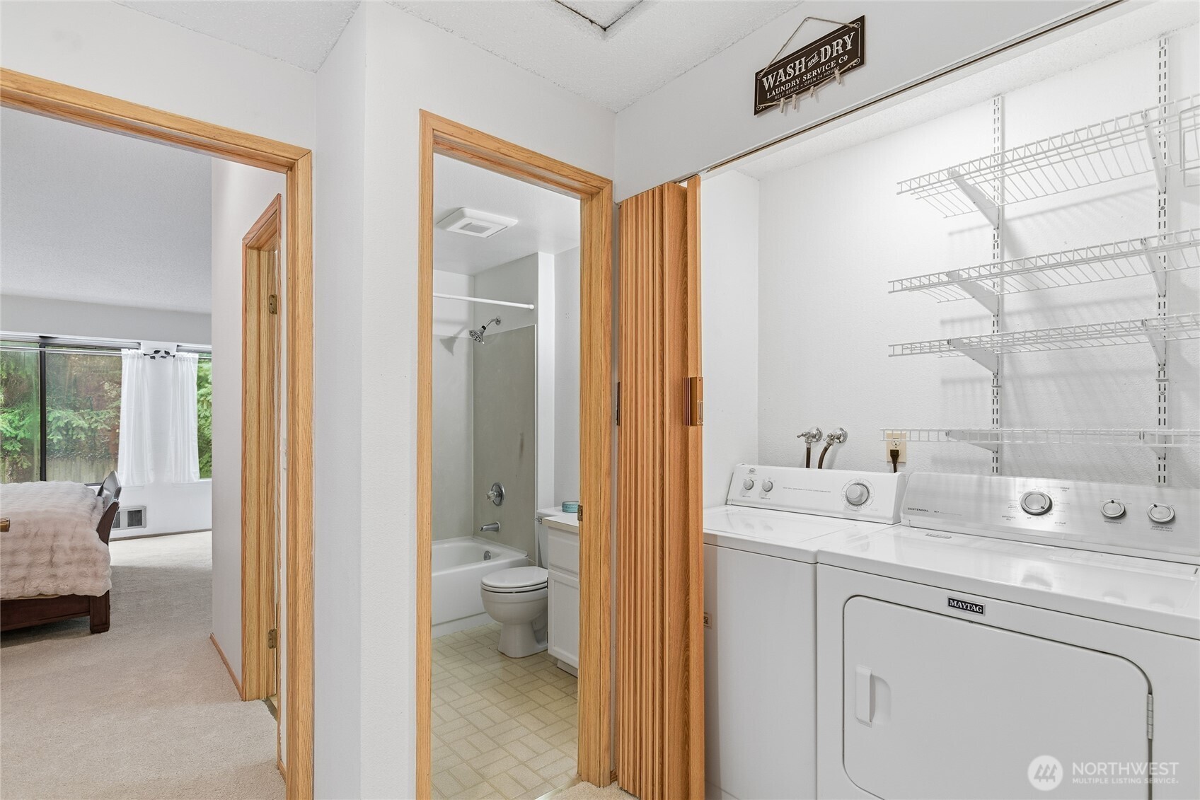 master bedroom with large windows and vaulted ceiling