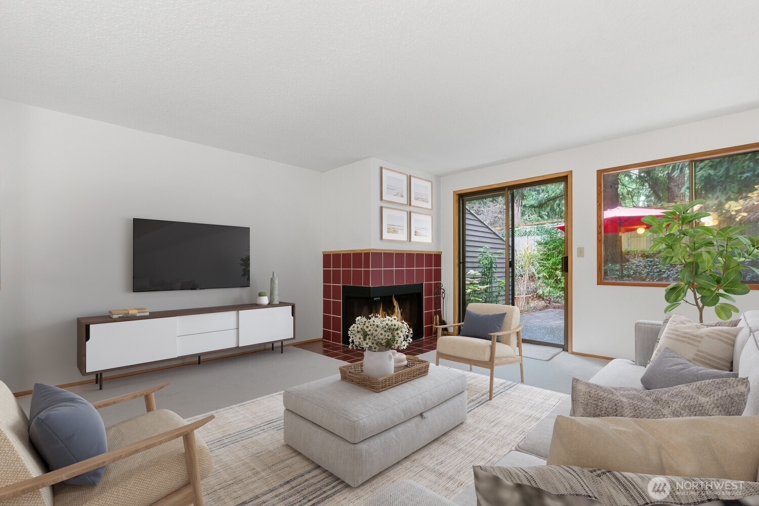 living room with new carpet and brick patio access