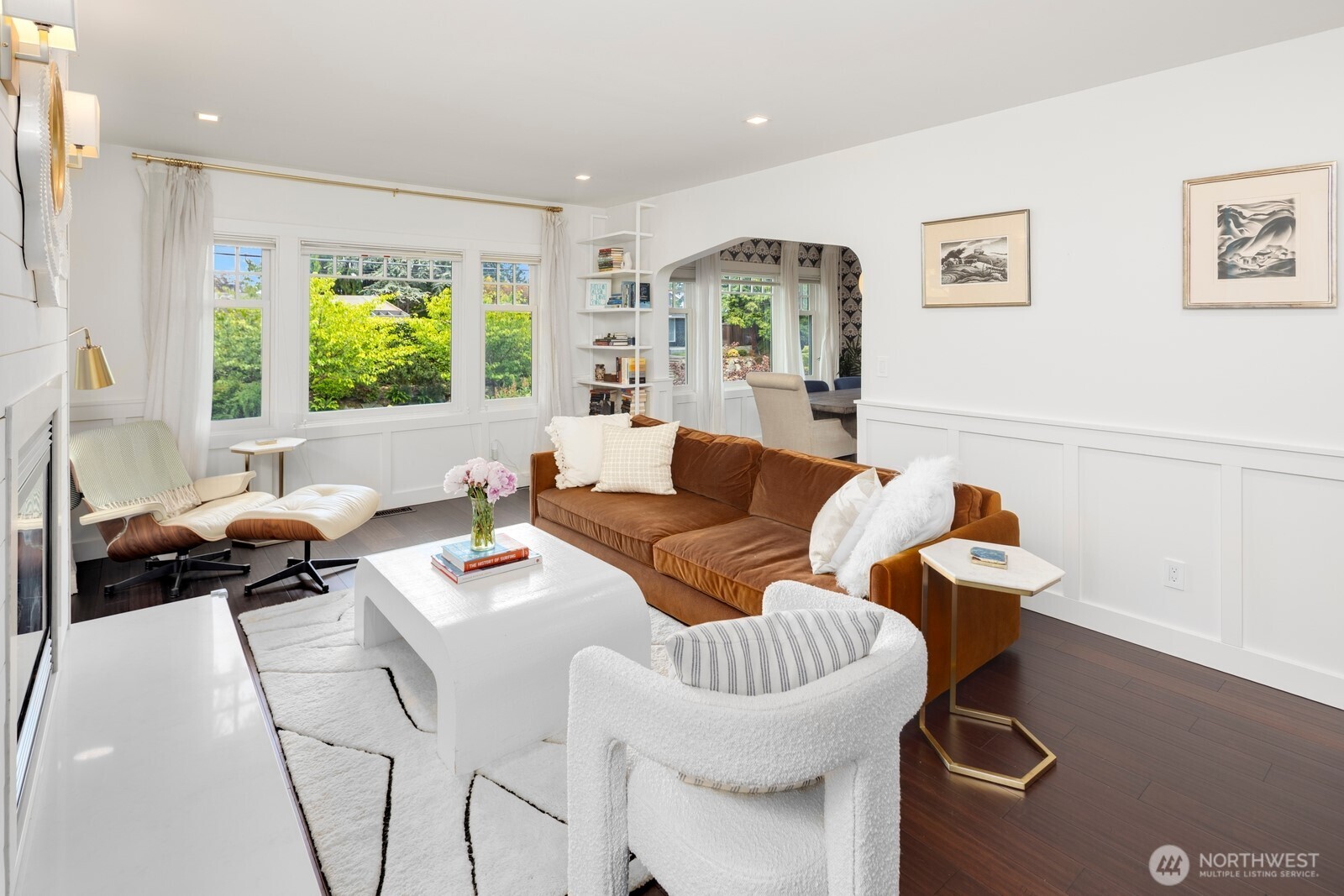 Timeless charm meets modern design in this thoughtfully updated home, where original character blends seamlessly with custom designer touches, including statement wallpaper accents throughout.