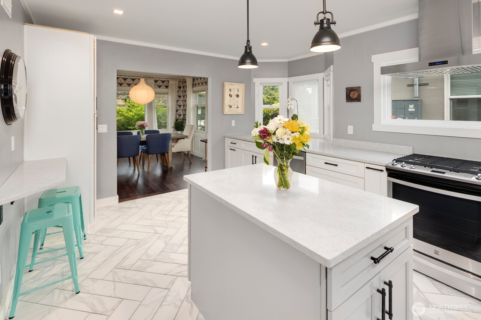 Stunning chef’s kitchen with custom shaker cabinetry, herringbone tile, and premium appliances—perfect for both everyday living and effortless entertaining.