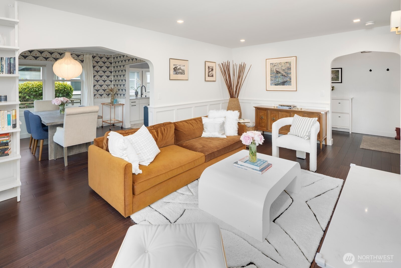 Bright and airy main floor featuring a spacious living room, formal dining area.