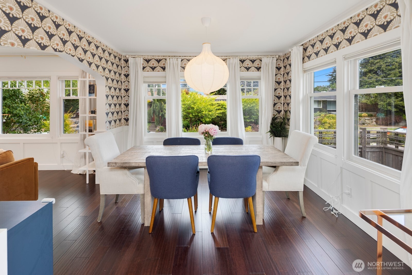 Formal dining room is flooded with natural light.