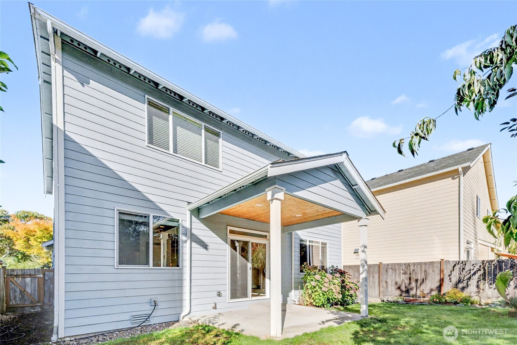 Beautiful outdoor oasis featuring a cozy covered patio—perfect for relaxing or entertaining year-round.