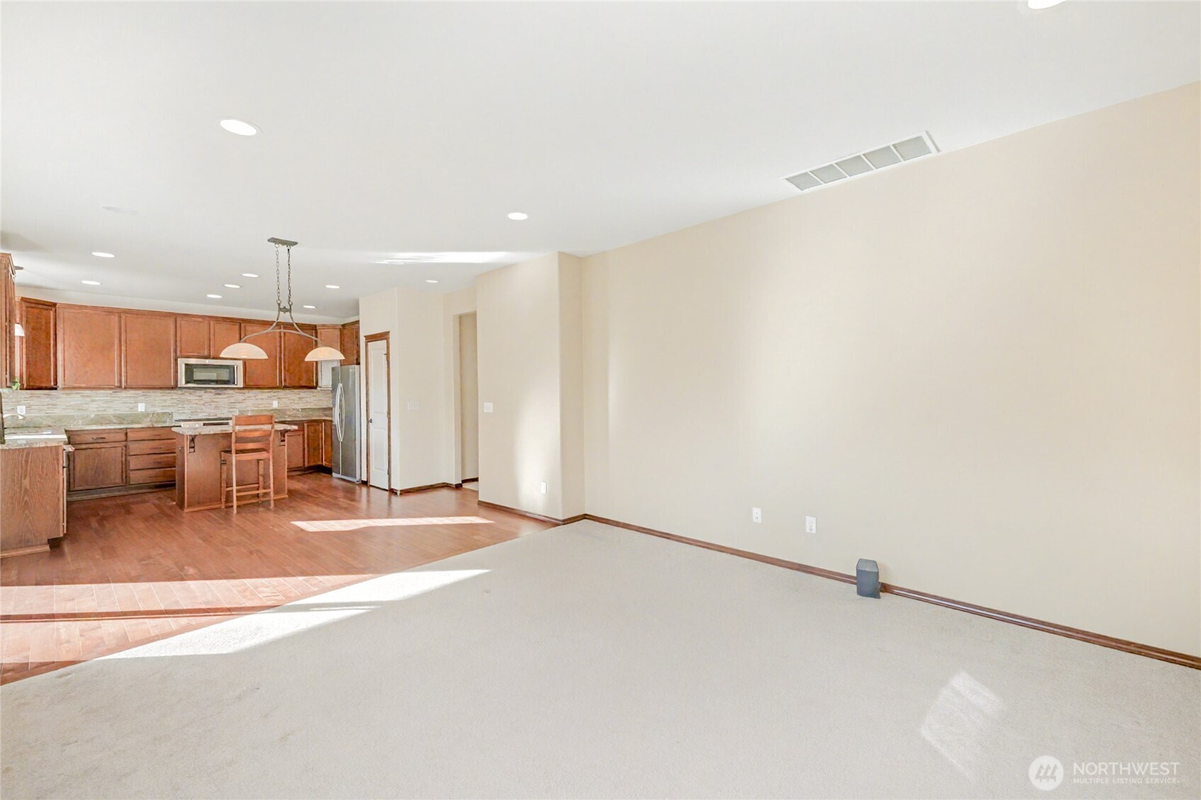 Kitchen seamlessly flows into the family rooms for easy entertaining and everyday gatherings.