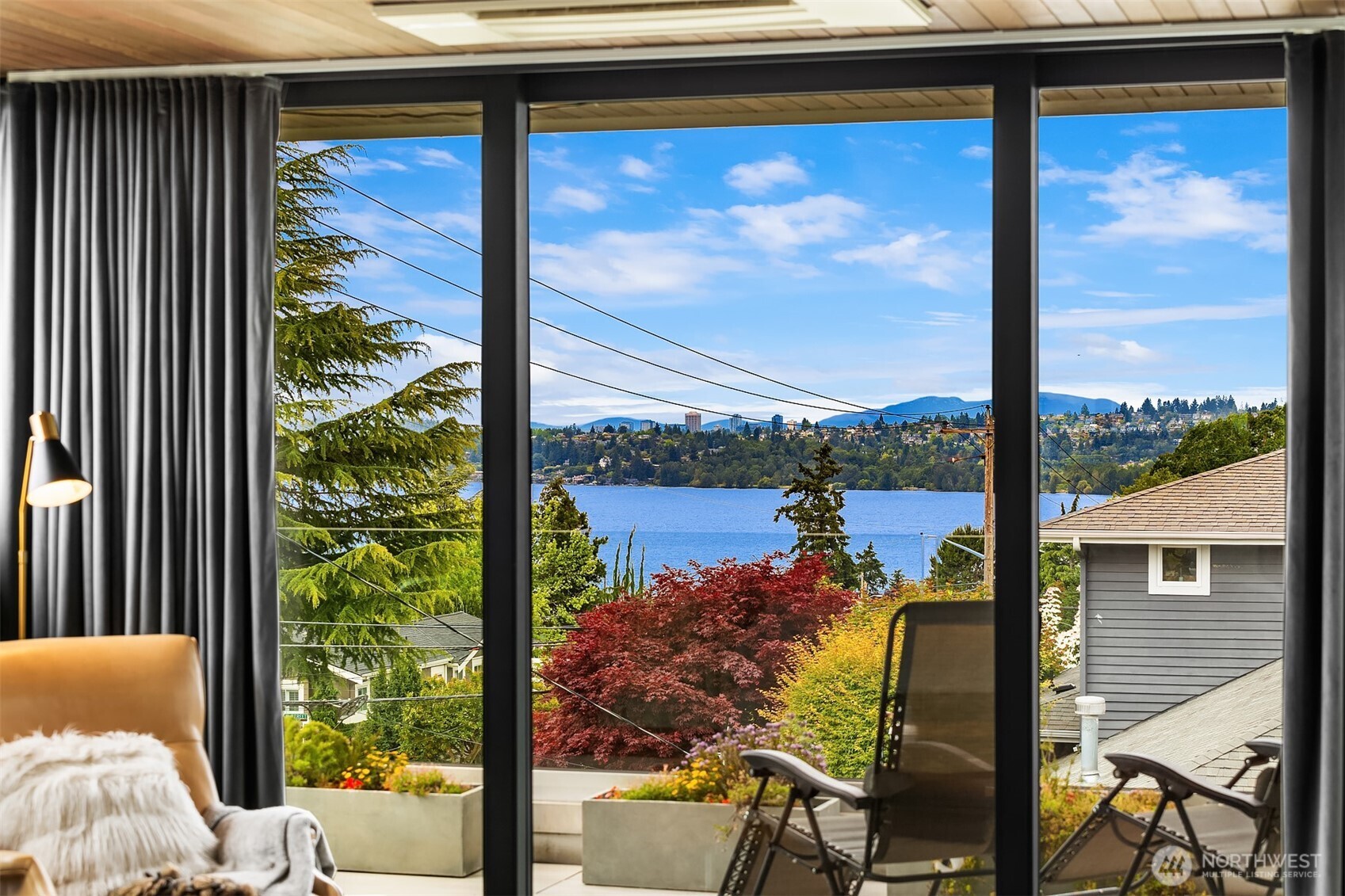 Primary bedroom views looking west. There's also views of Mount Rainier and downtown Bellevue to South