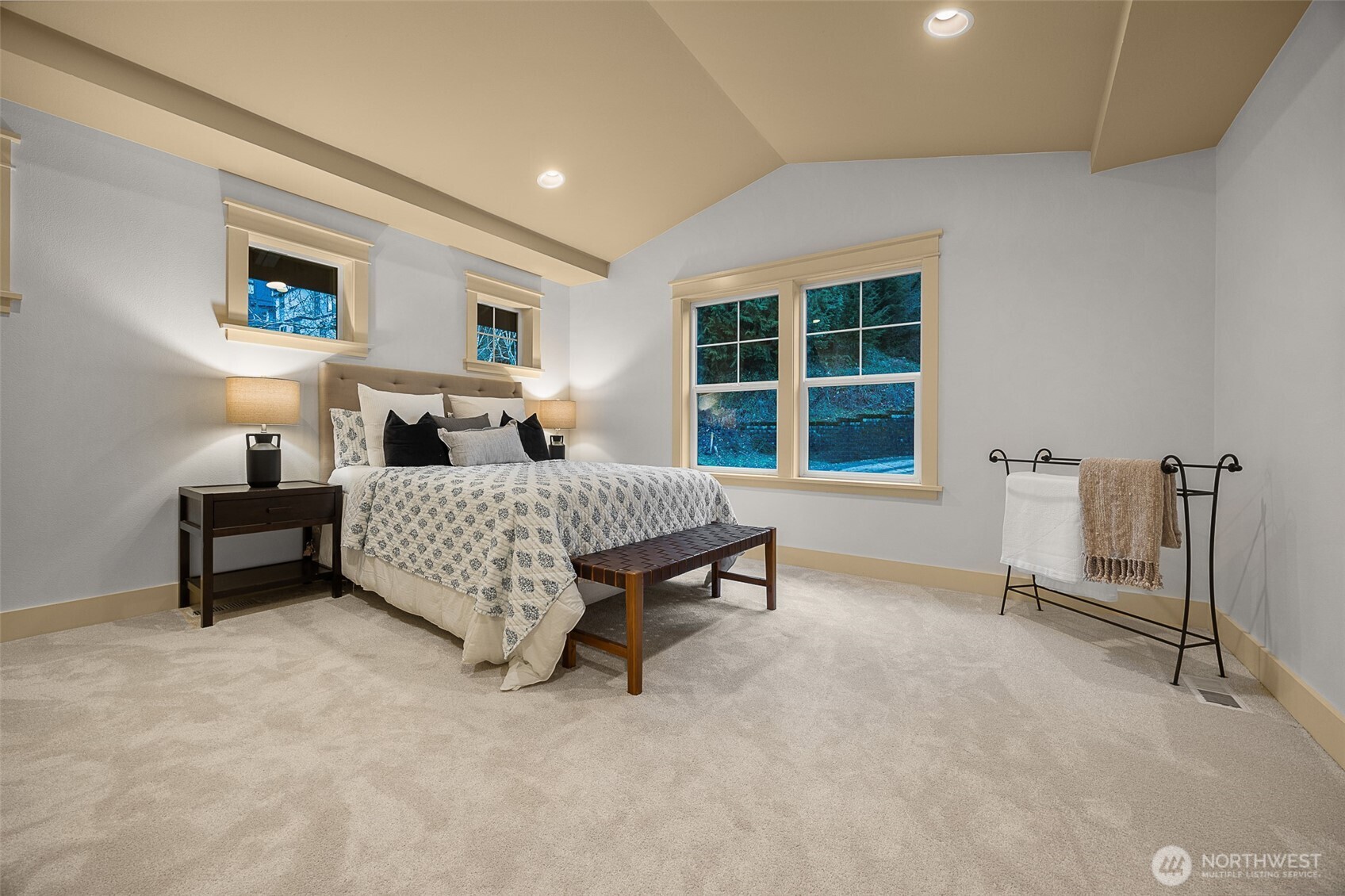 Additional primary bedroom with vaulted ceilngs