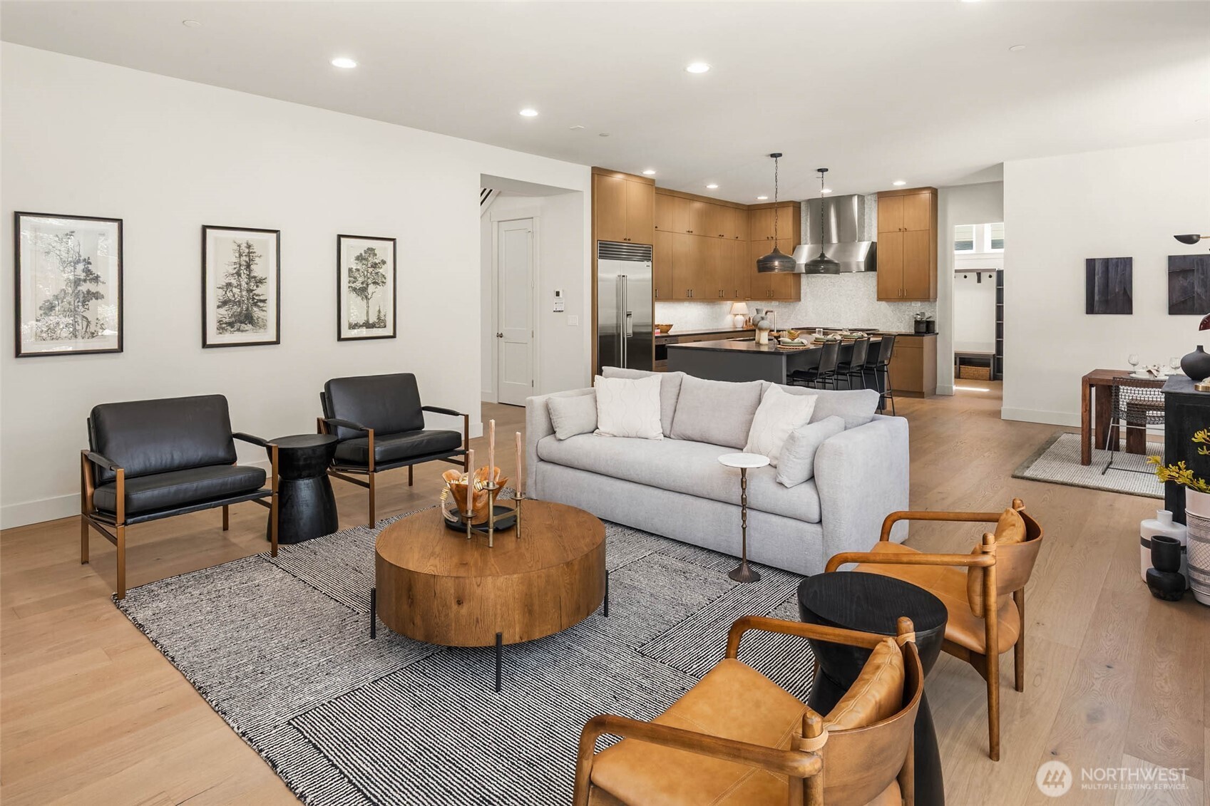 Extensive use of wide plank hardwood flooring throughout the home includes all of the main floor, stairs and treads, upper hallway, upper level rec/media room, and Primary bedroom