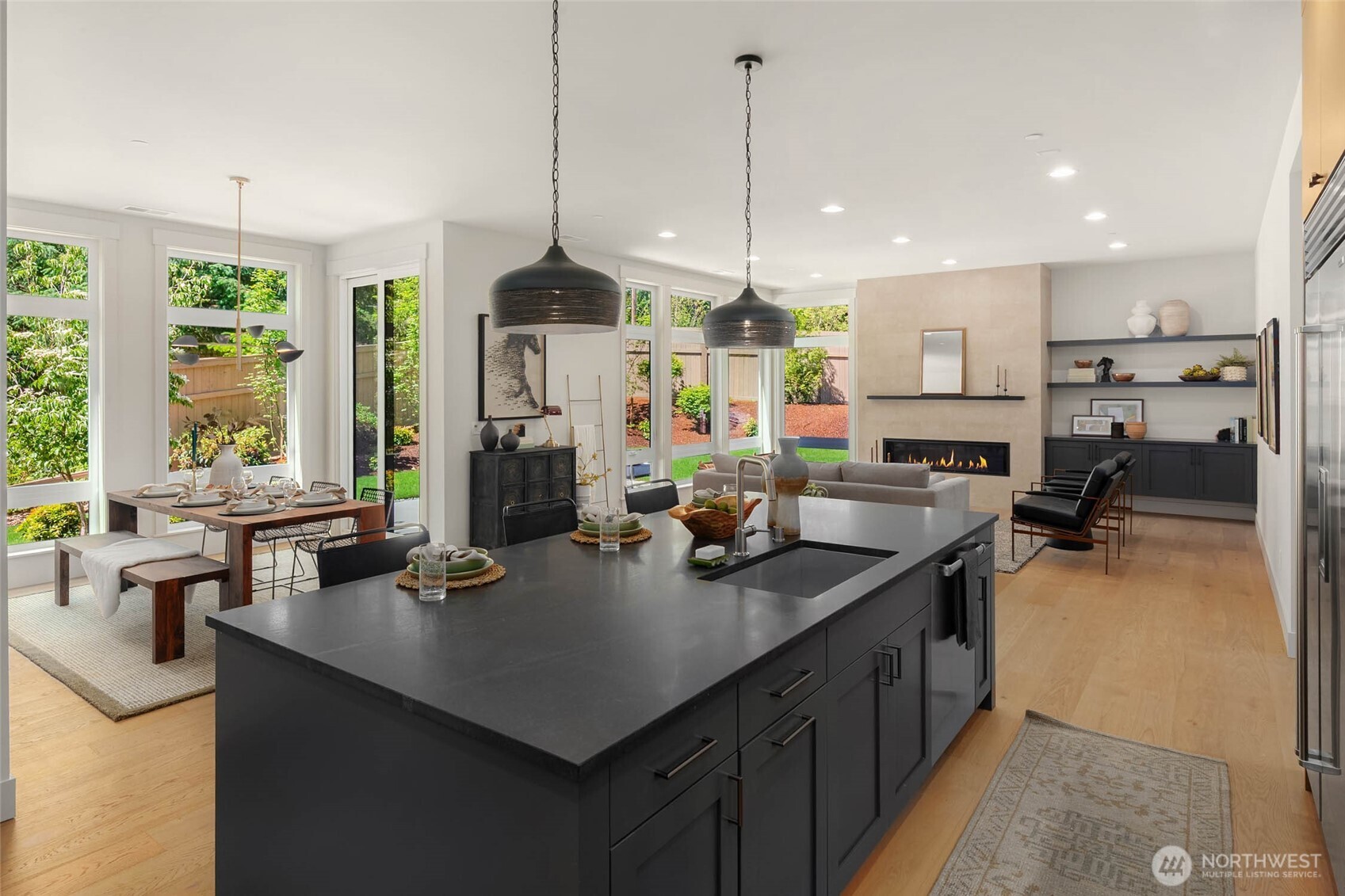 Large island with designer selected slab counter and custom built painted cabinets