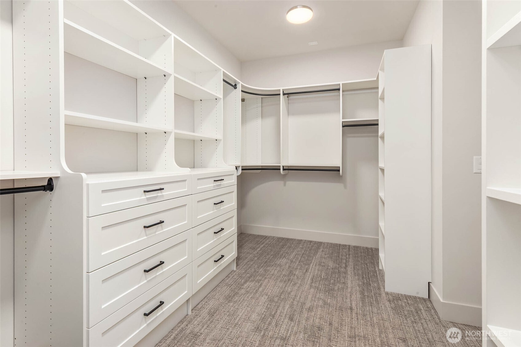 Generous Primary closet with custom designed/built solid shelving. Solid shelving throughout the residence