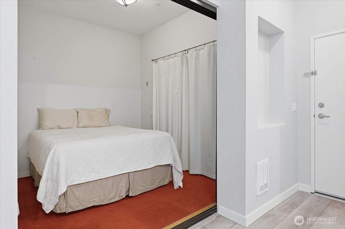 Cozy, efficient bedroom.