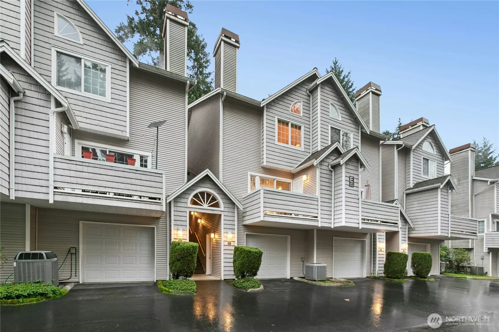 Welcome to Unit E4. Come down the private drive, park in one of your two covered carport spots, or pull into the 2 car tandem garage.