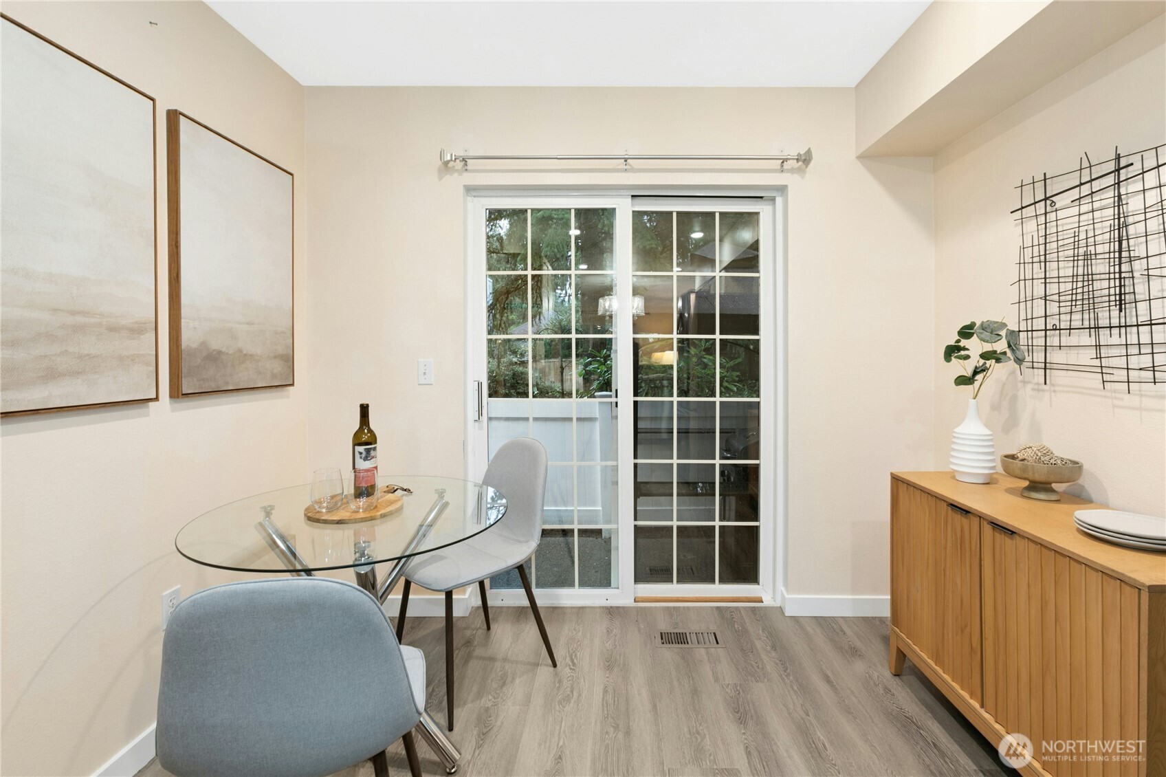Eat a snack or dine in teh breakfast nook in the mornings. Extra space to add in a wine rack, more cabinets, a display, or anything you like. Connects via sliding door to the back patio.