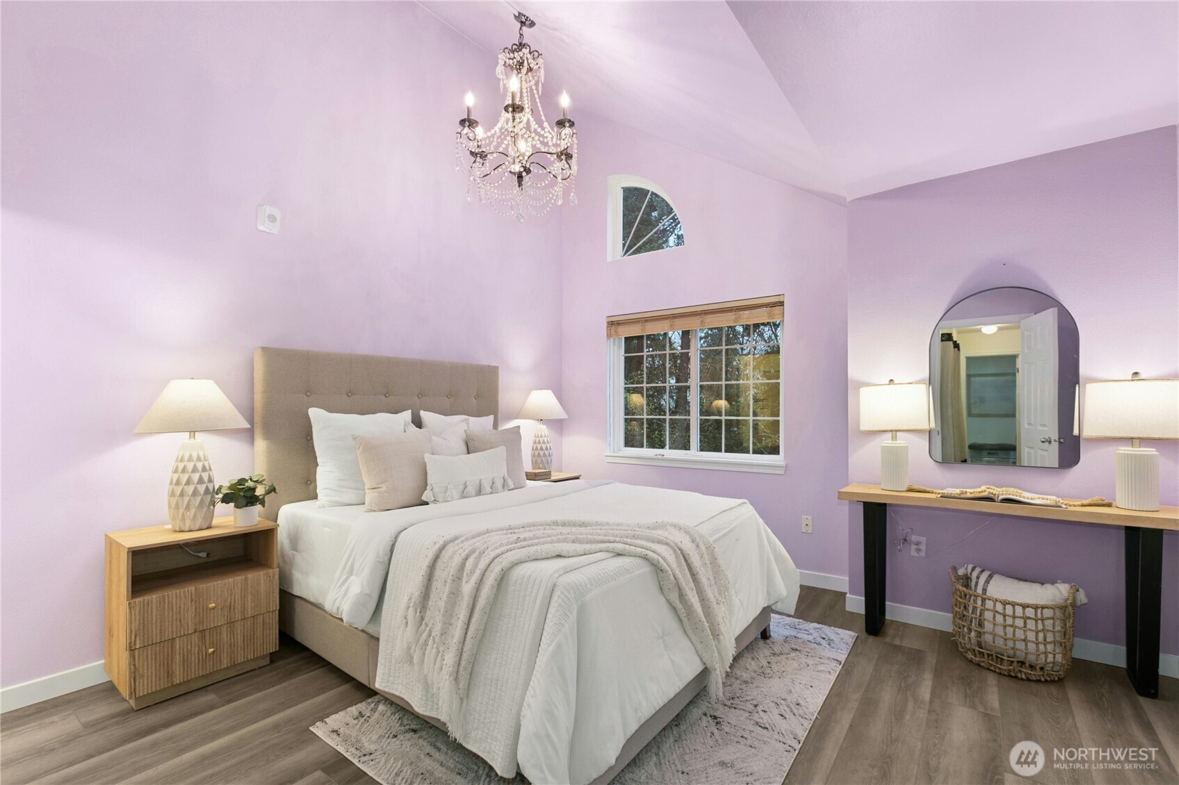 Step upstairs to the primary bedroom, complete with vaulted ceilings. Let in the natural light, and enjoy the designer lighting above.