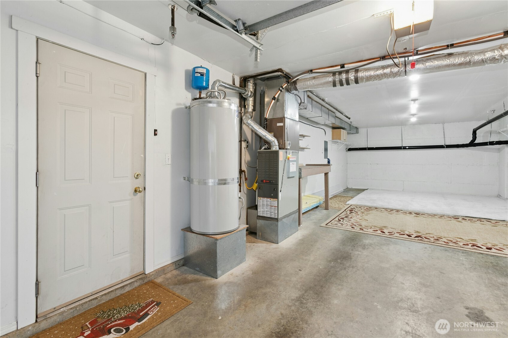 Park in the oversized two car tandem garage. Or, park outside in one of your covered spots, and finish this space to use as a rec room, exercise room, shop, or office, and still have room for storage.