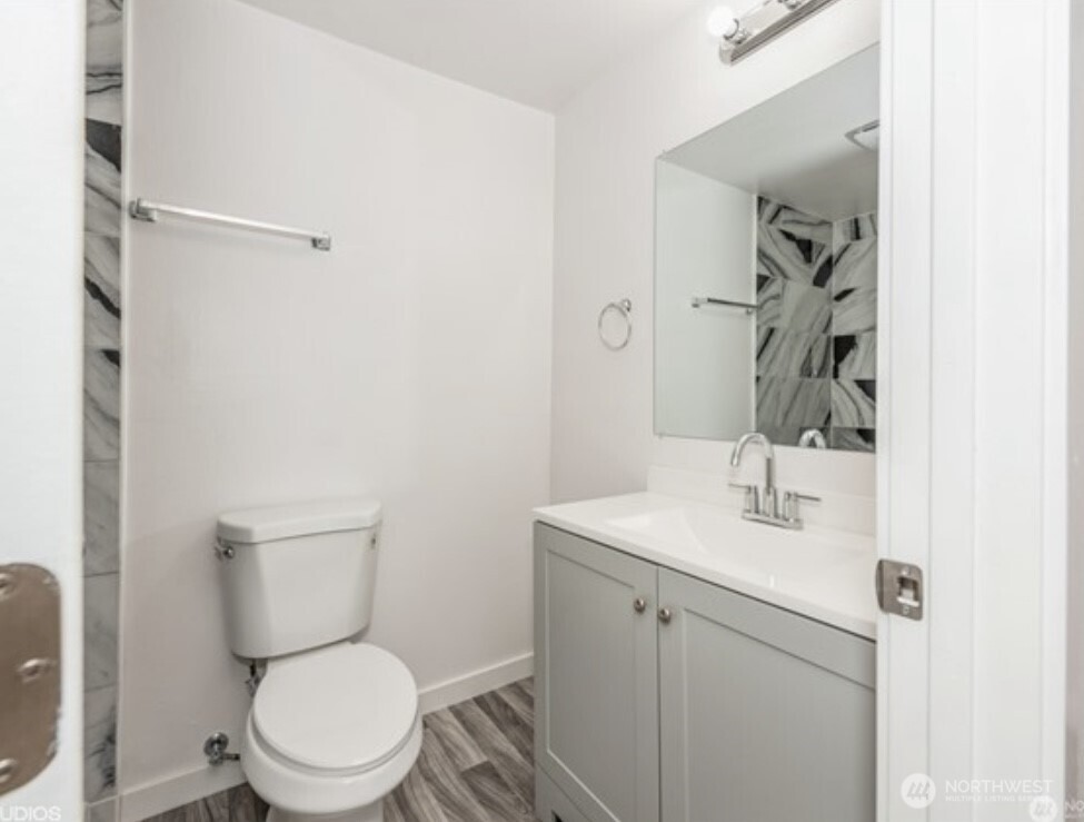 The primary bedroom features a shower designed for easy access and safety.