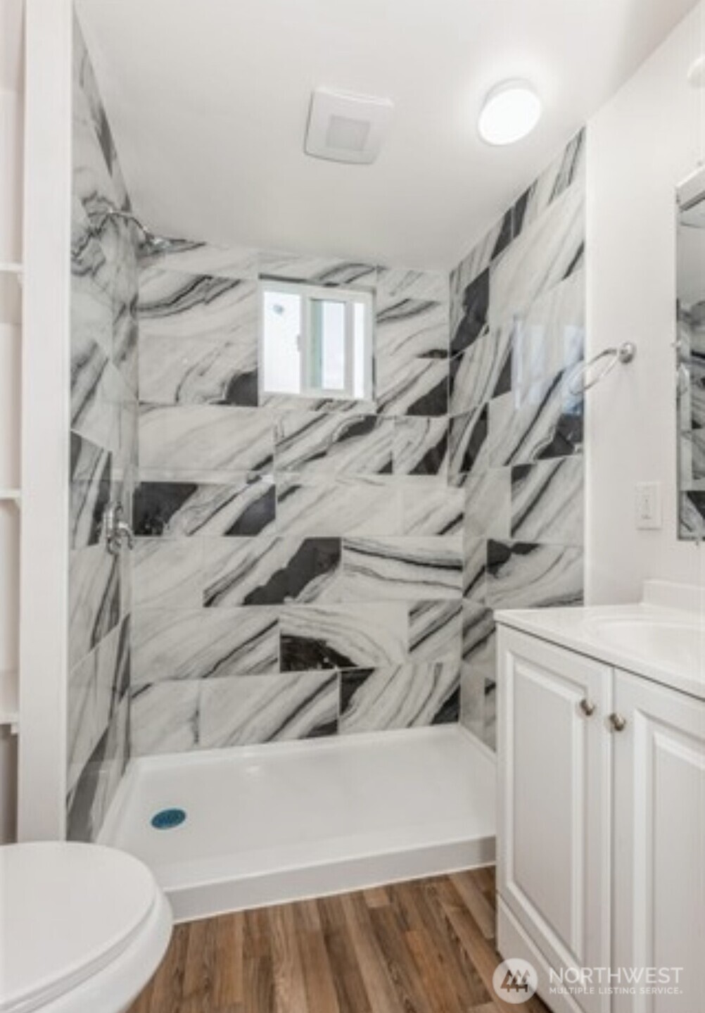 A second bathroom with shower, providing added convenience for guest and household members.