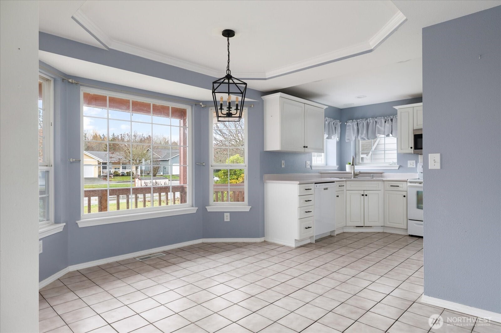 Bay window fills the dining area with natural light.