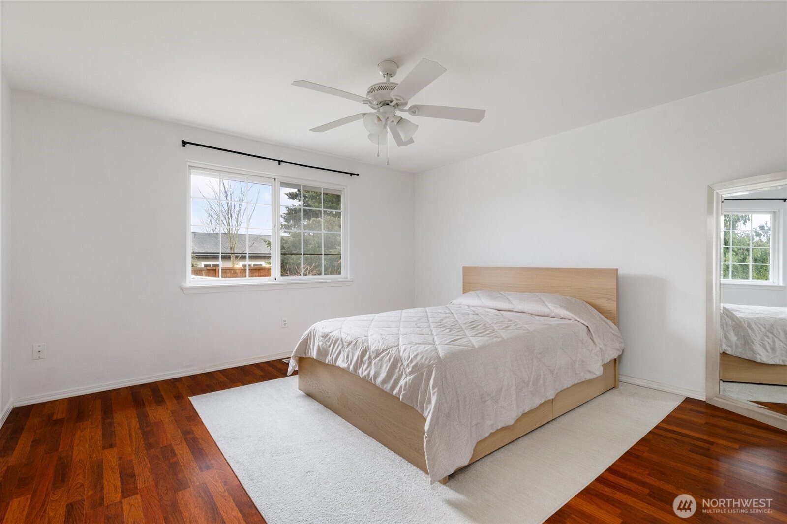 Primary bedroom situated separately from the other two bedrooms for added privacy.