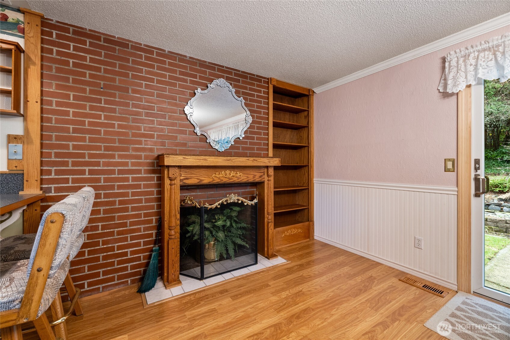 Built in book shelf and wood fireplace