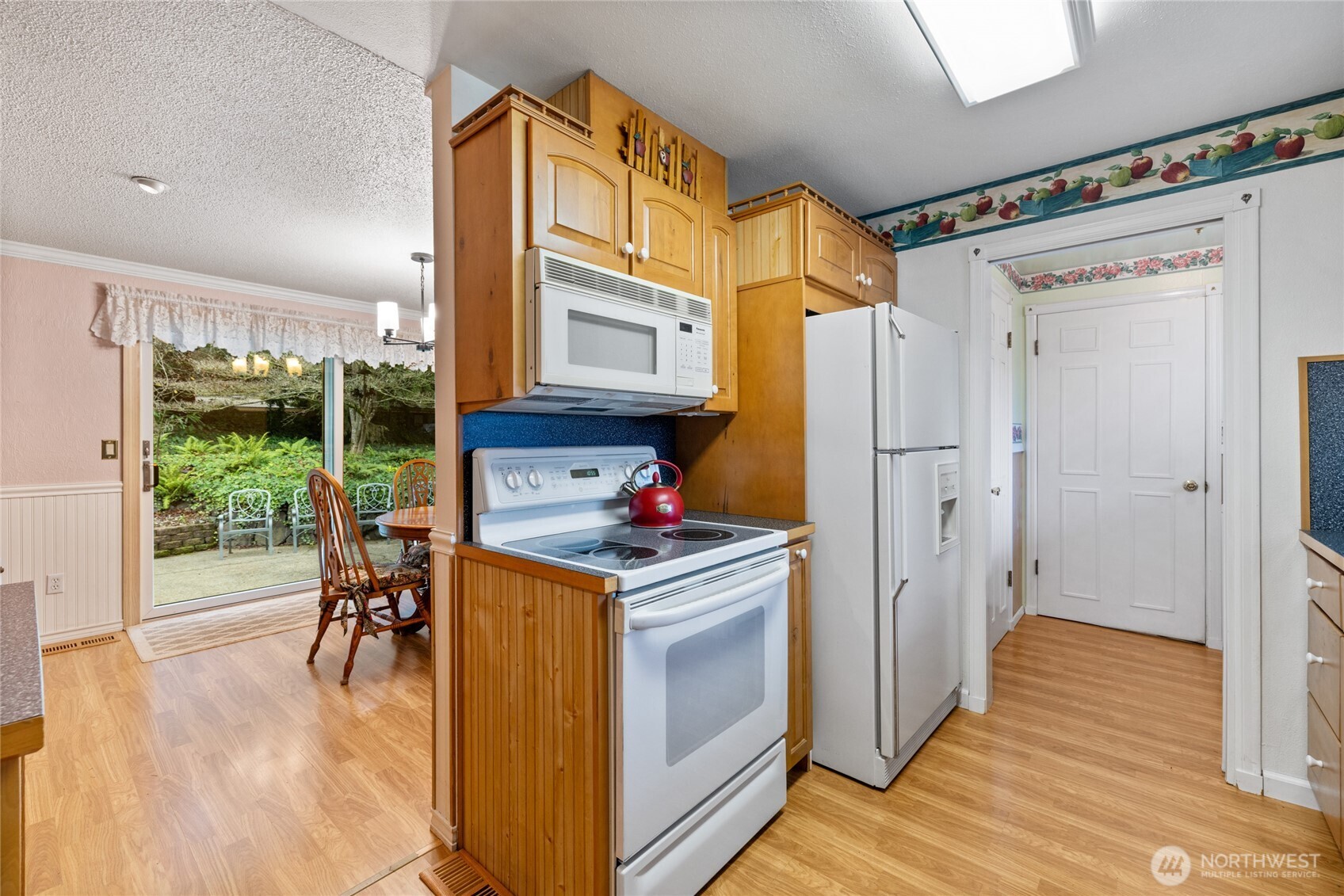 Newer Renewal by Anderson Sliding door leads you to the beautifully landscaped back yard.