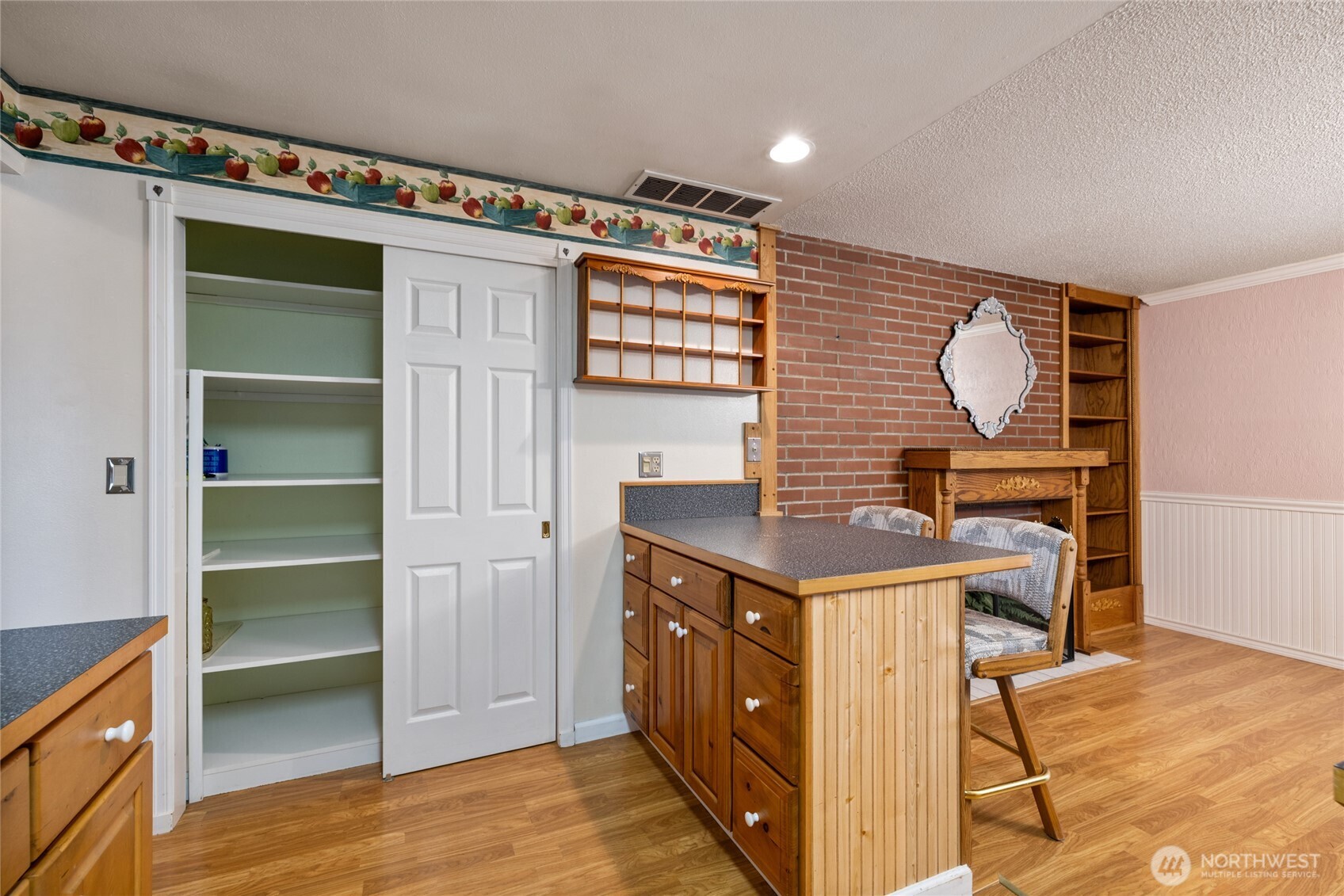 Kitchen pantry with newer 6panel sliding doors.