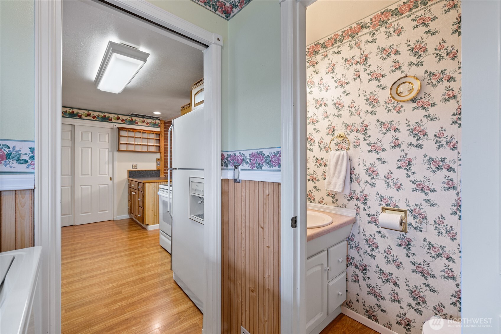 Powder room near kitchen and off utility room.
