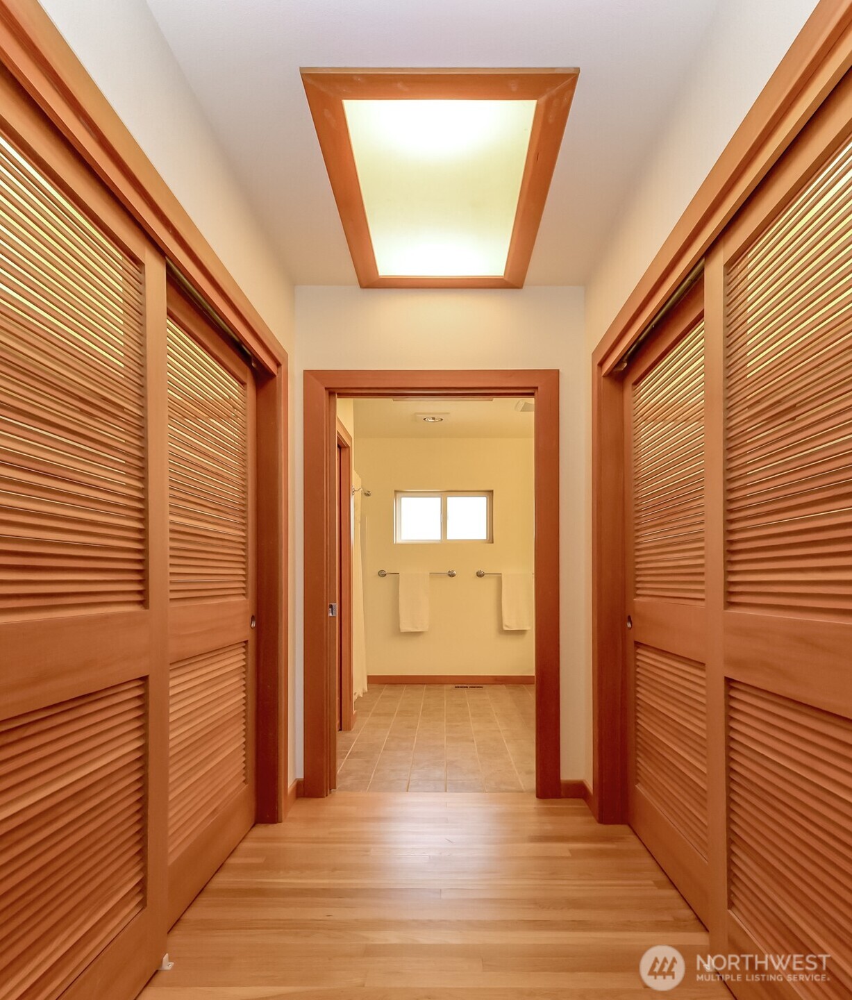 Large walkin closets with lighting and skylight