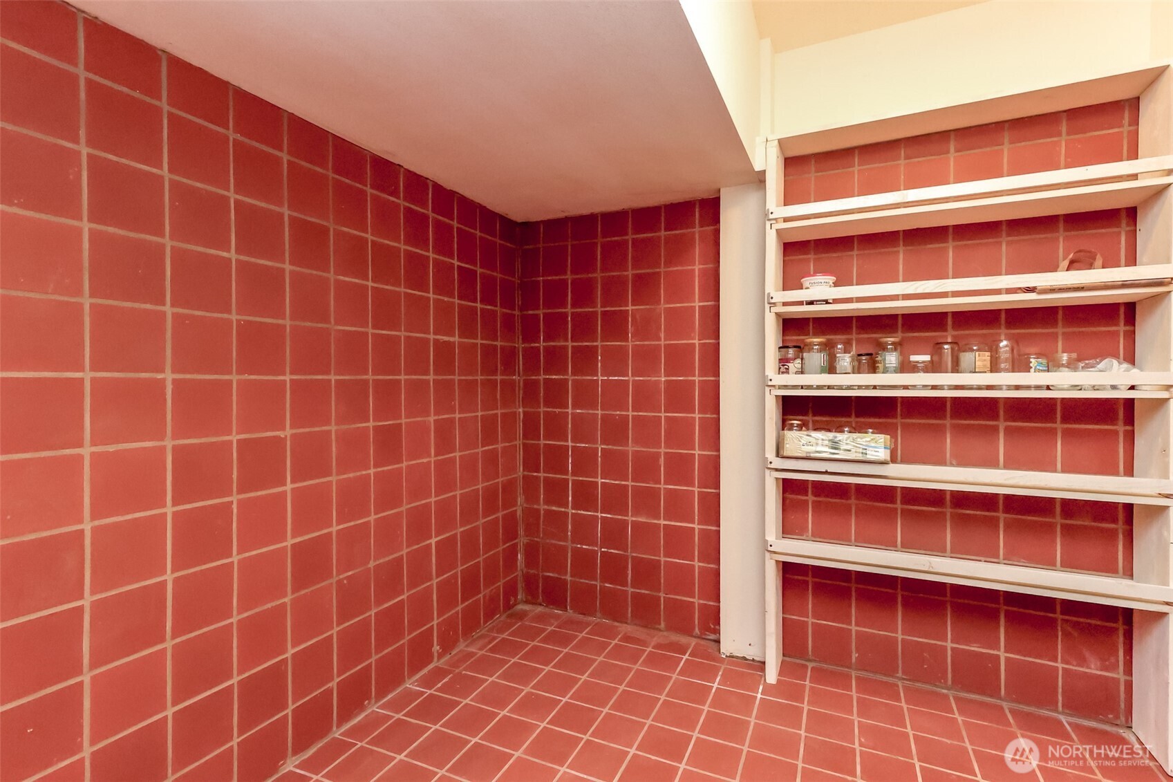 Under the stairs cold storage area great for wine cellar and storage