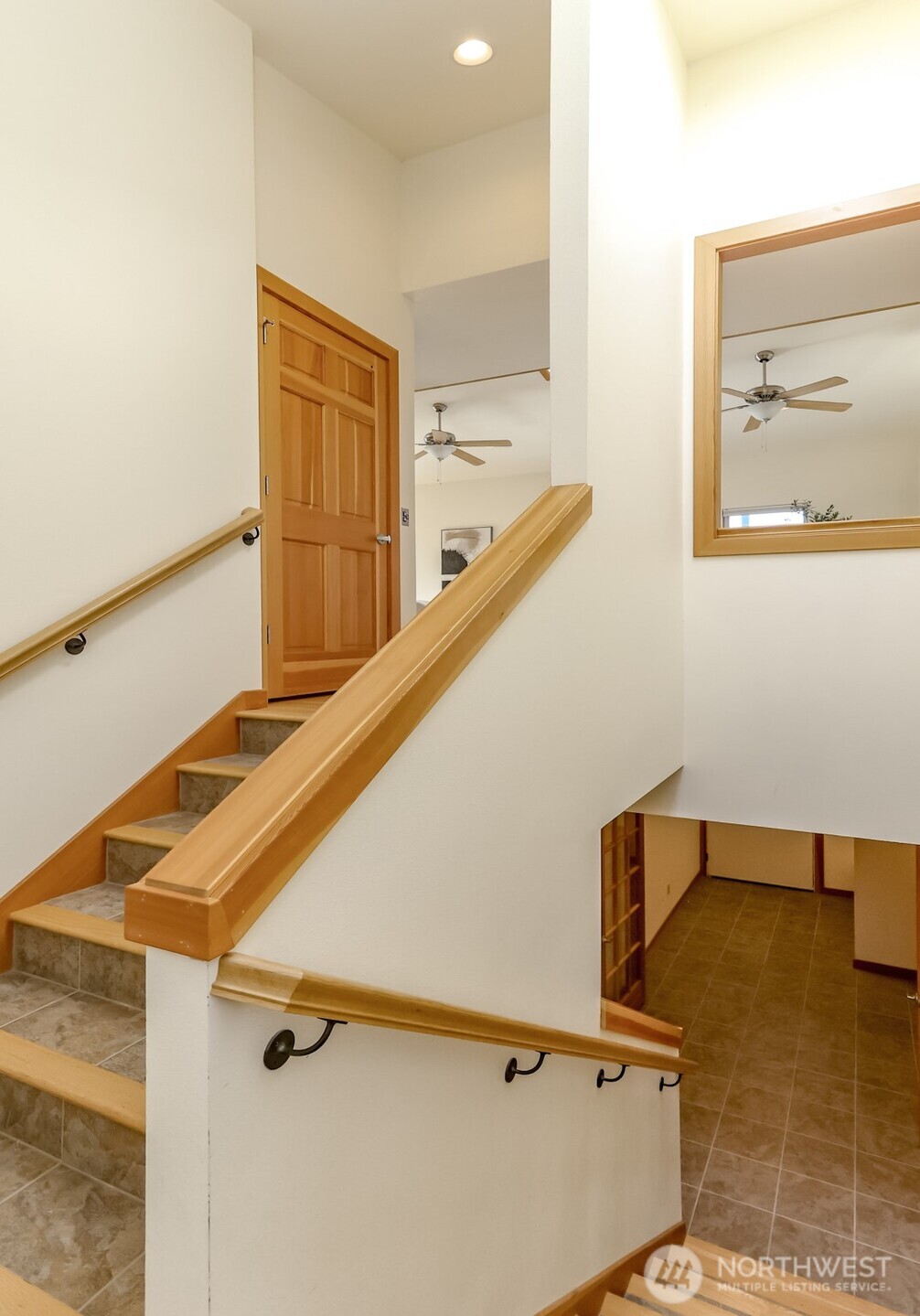 Hallway leads to bedrooms and has two hall closets one for linens and one with wiring for security cameras and internet