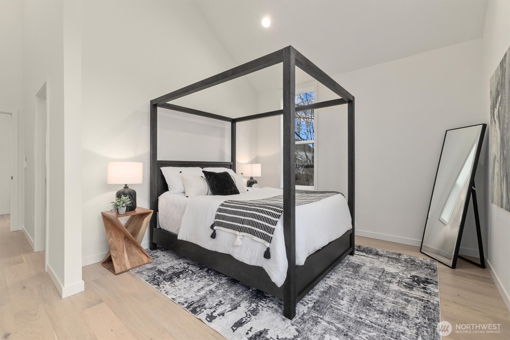 Primary bedroom with vaulted ceilings
