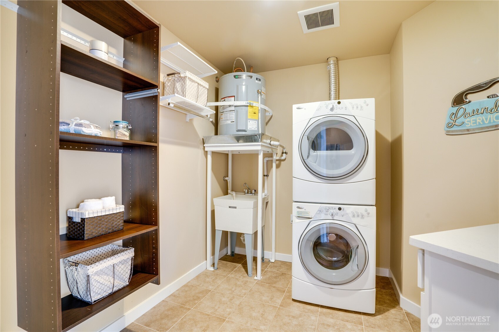 Oversized Utility room with new hot water heater.