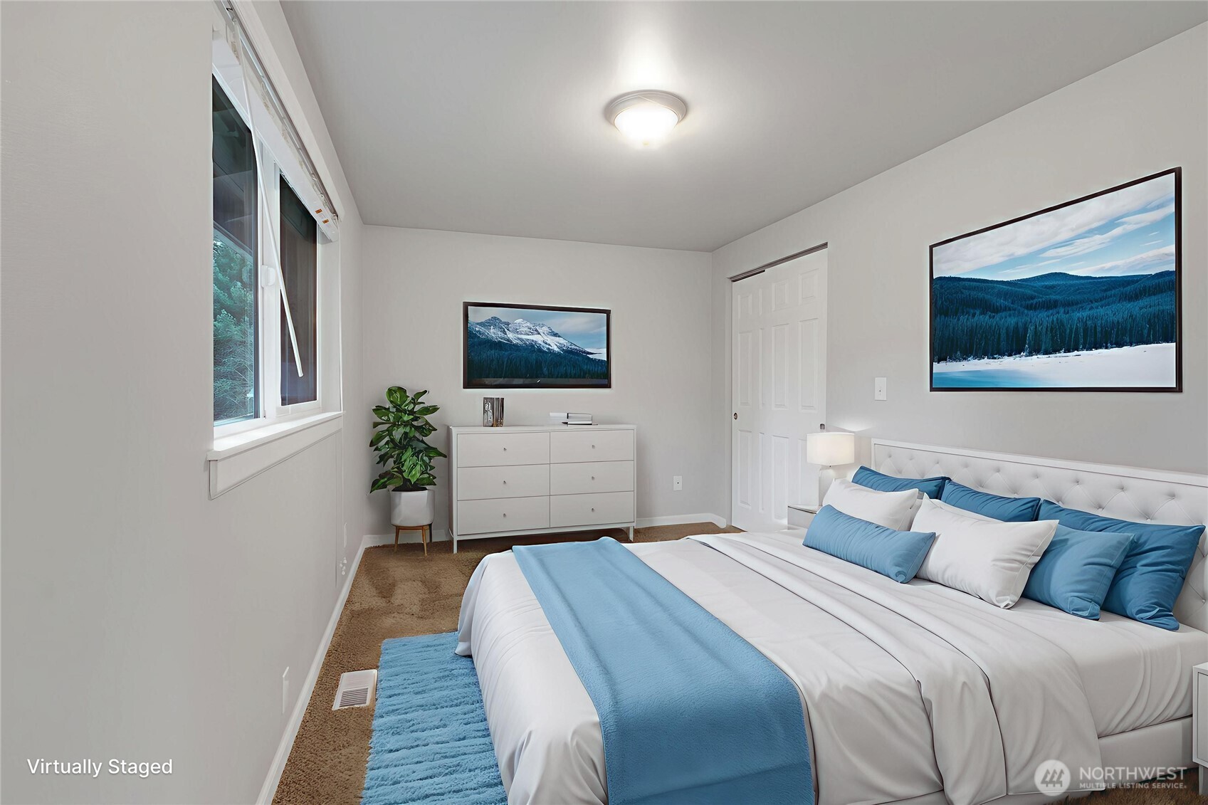 Primary Bedroom with a window facing the backyard. *Virtually Staged*