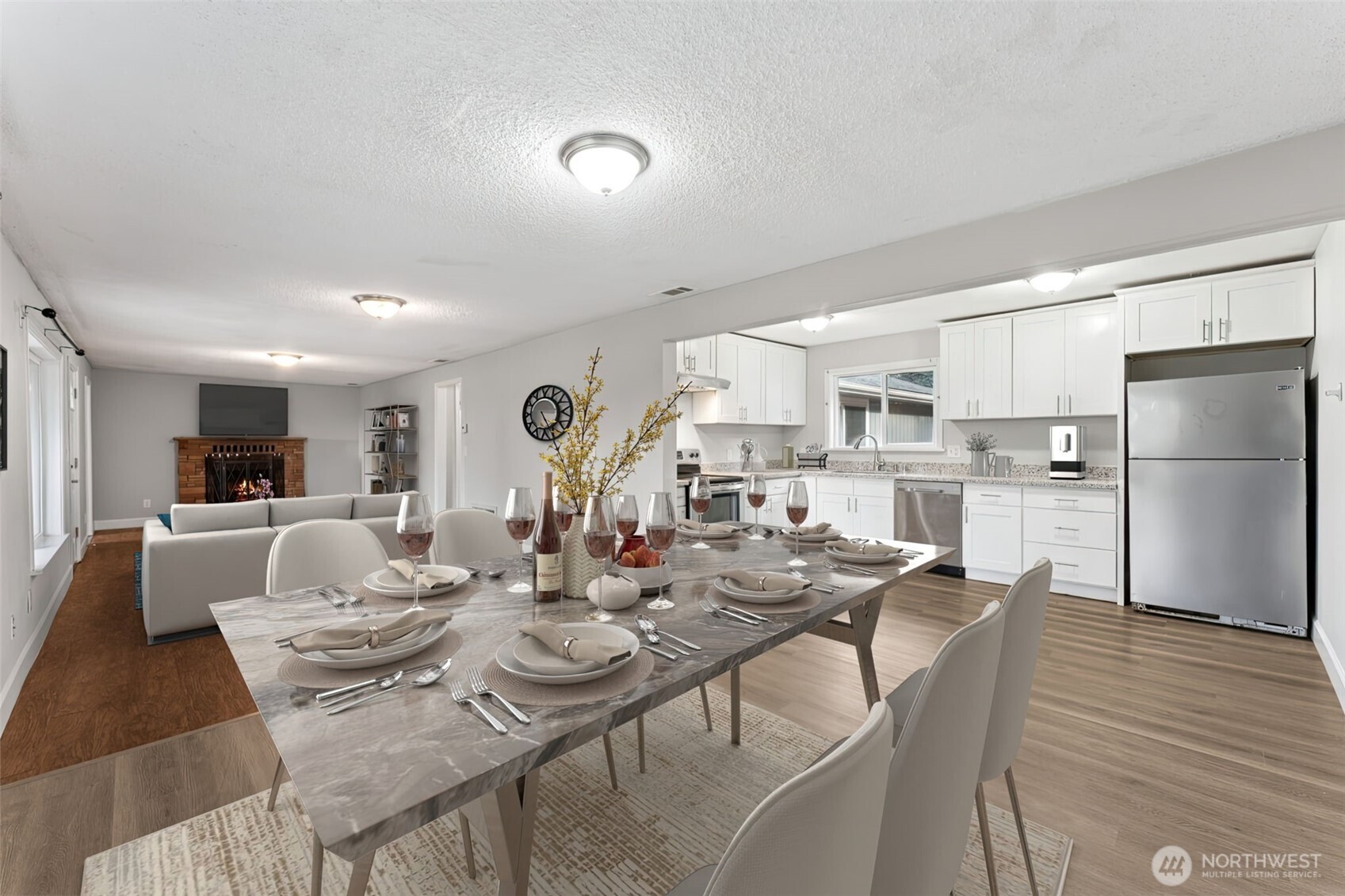 * Virtually staged- Kitchen and great room on the 1-story side of home. Office room is to the left of fireplace.