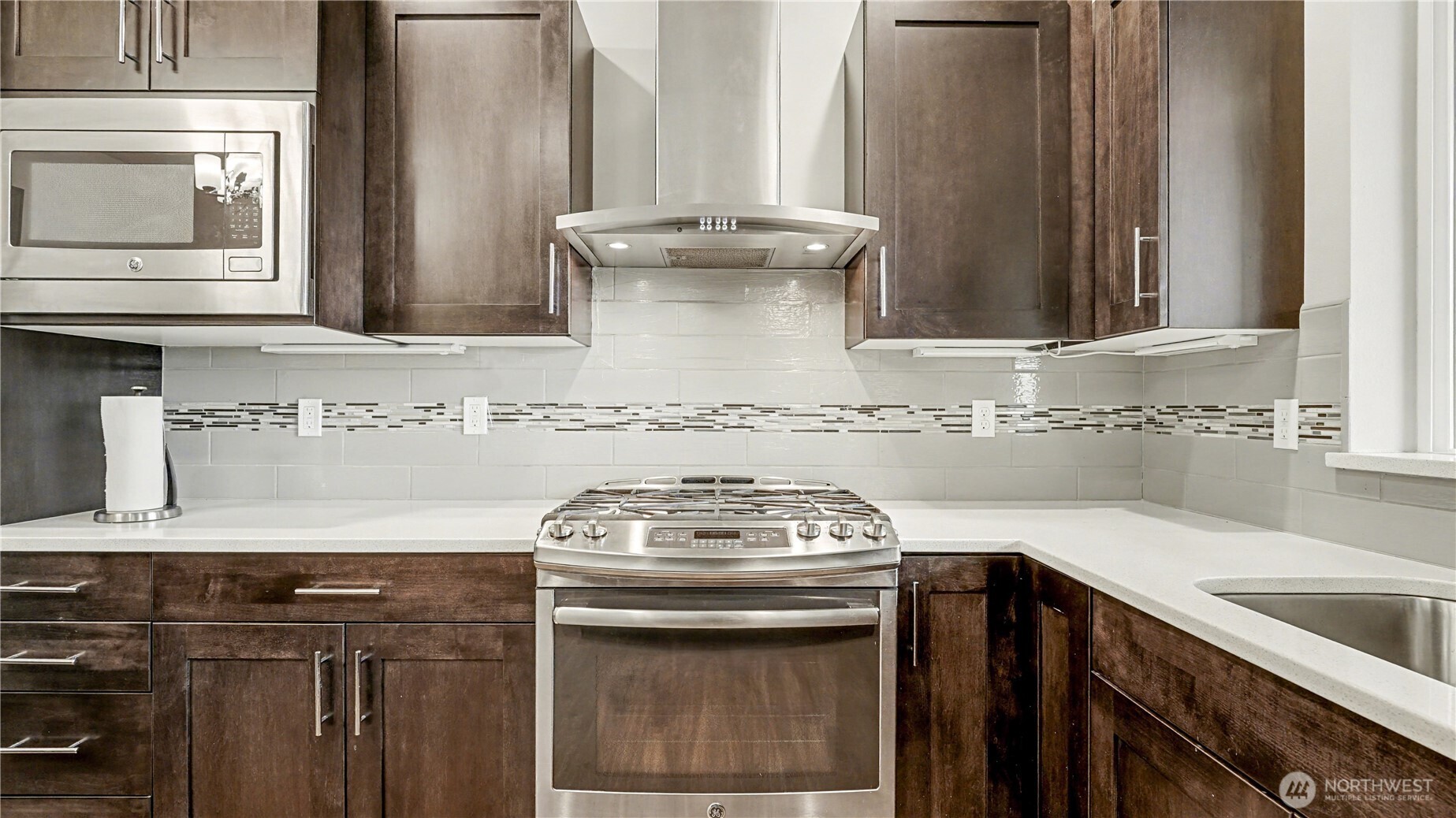 Kitchen also offers plenty of cabinet and counter space.