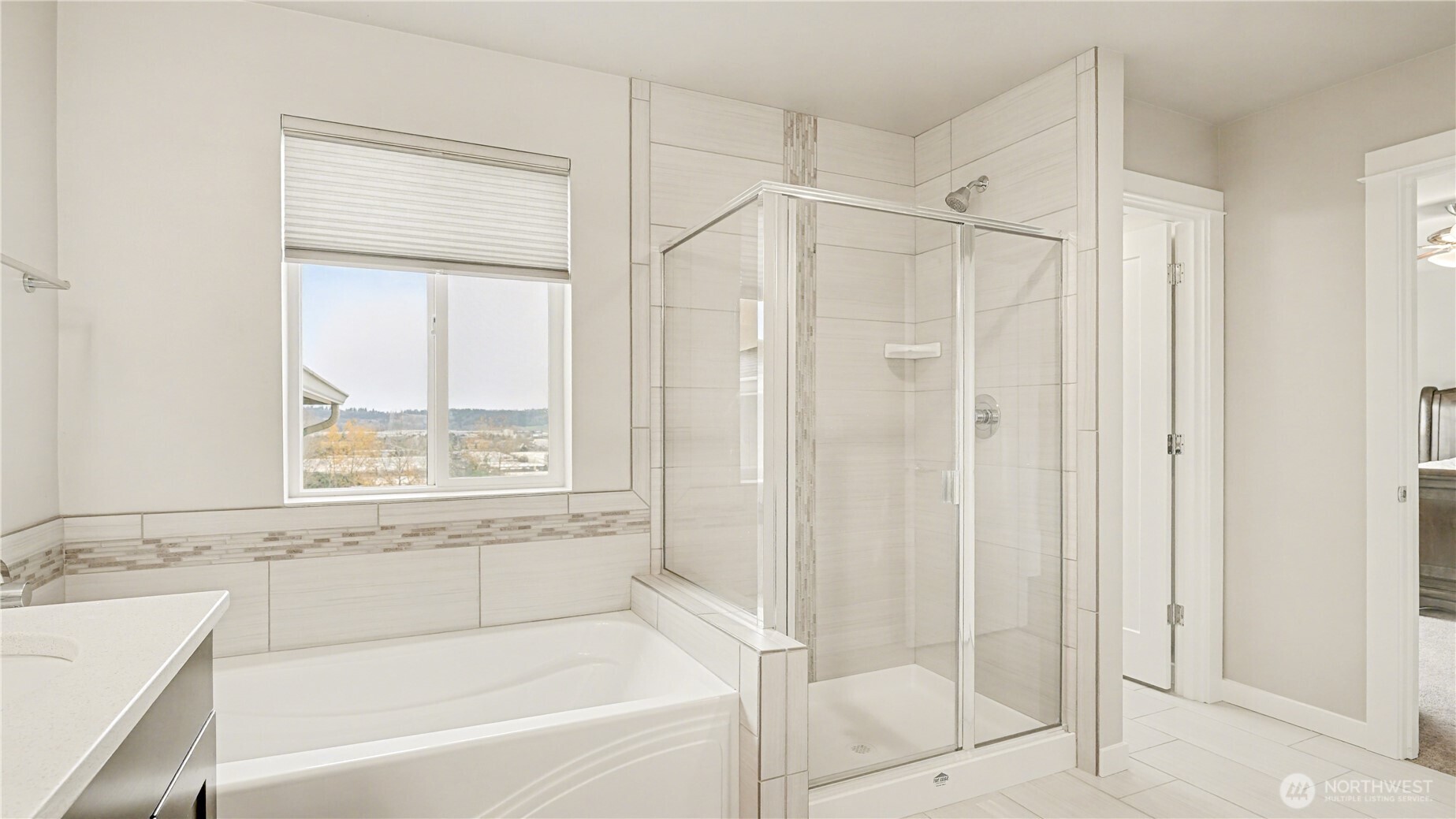 Features both a soaking tub and a standalone shower for ultimate comfort.