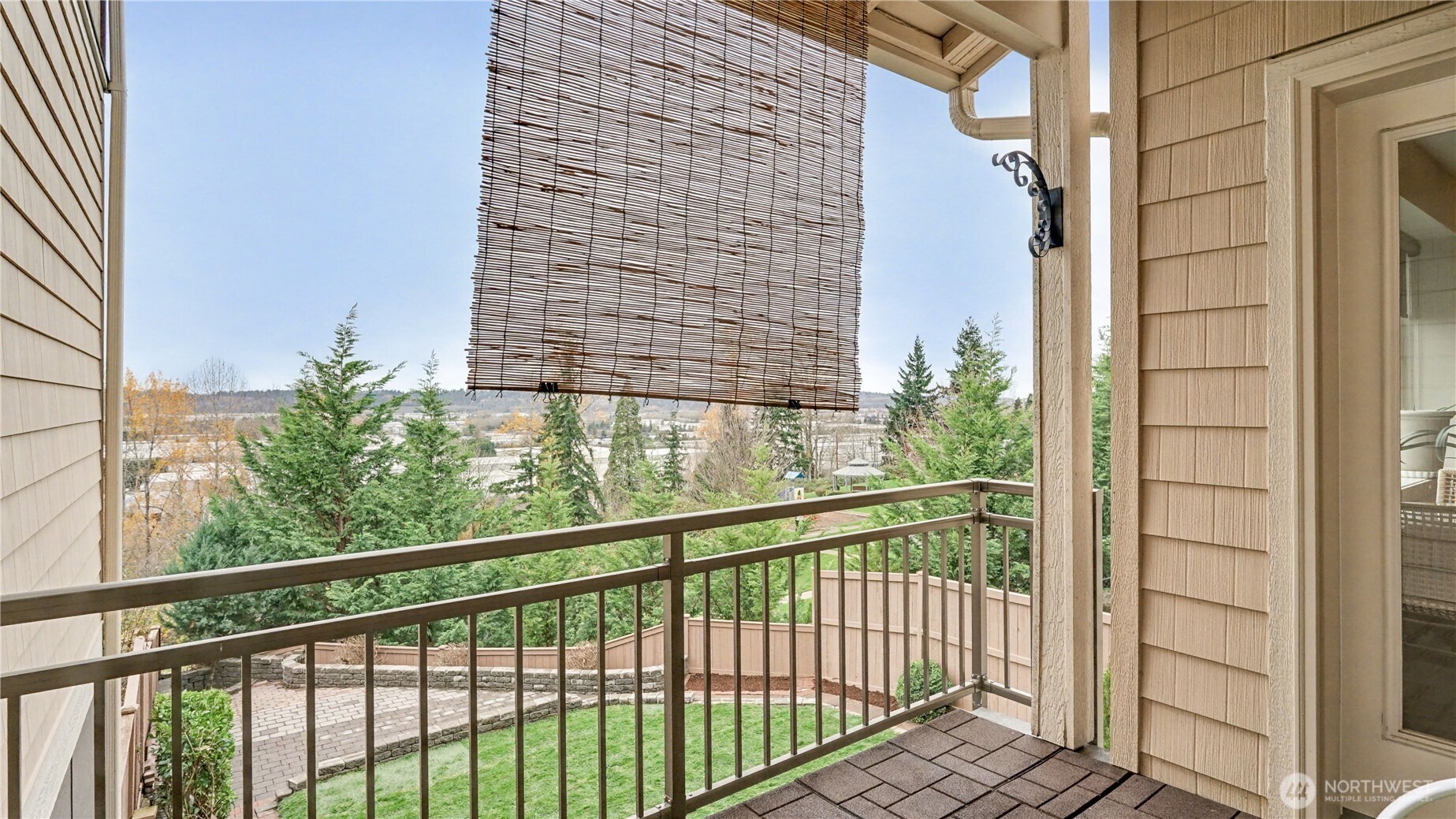 Easy outdoor living year-round on this spacious, covered balcony.