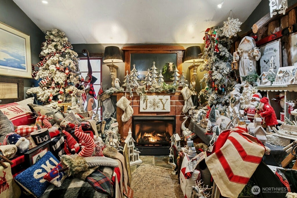 Additional building with fireplace currently being used as part of Christmas Shop business.