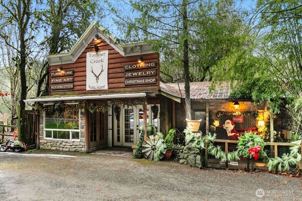 Front entrance to active "Timber Creek" business. This building use to be the old orignal Carriage House for the home. The original home is the building adjacent to right of this front entrance.