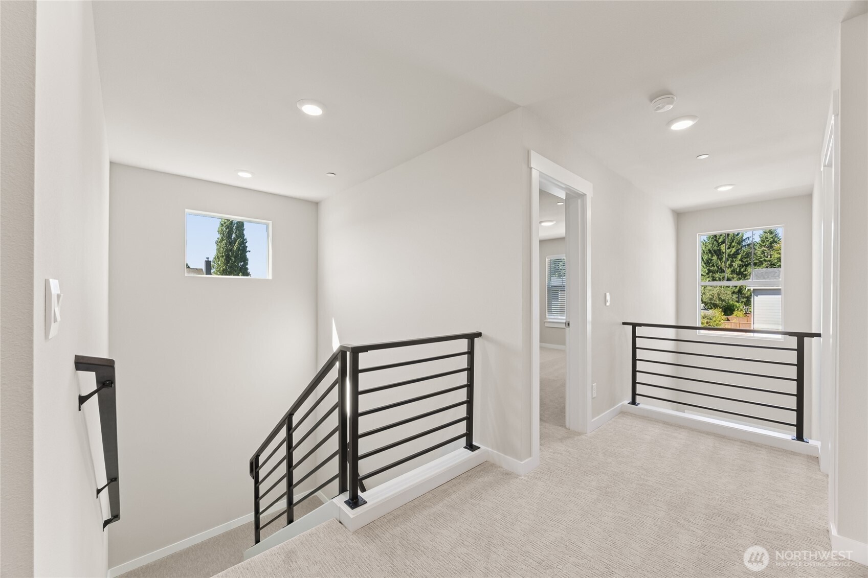 Open and airy upstairs landing, with 2 story entry!