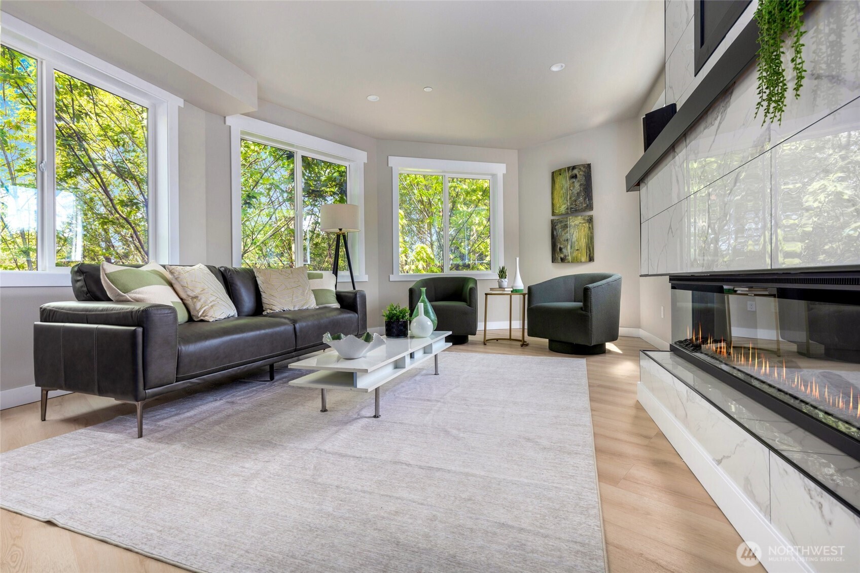 Enjoy the lush green belt from every one of this living room windows - feels very private.